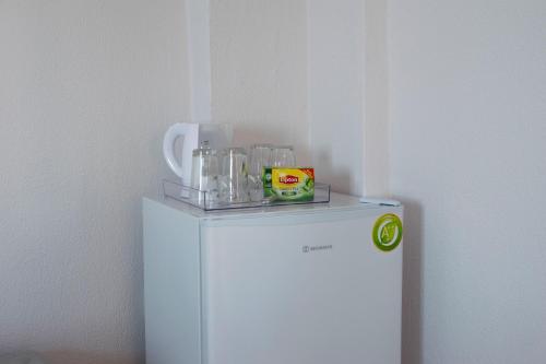 a white refrigerator with a shelf on top of it at Vrahos in Kardamaina