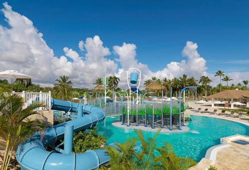 a pool at a resort with a water slide at Meliá Caribe Beach Resort-All Inclusive in Punta Cana