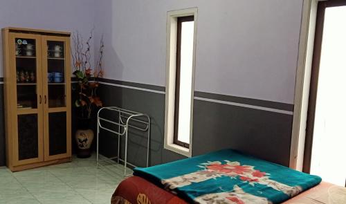 Postel nebo postele na pokoji v ubytování Holiday Home Anggun Bromo