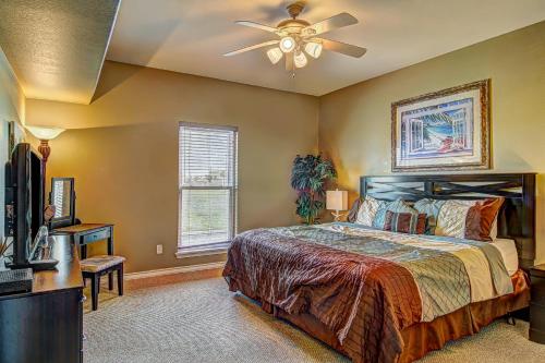 a bedroom with a bed and a ceiling fan at Snow Condos in Padre Island