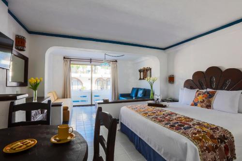 Ліжко або ліжка в номері Los Arcos Suites