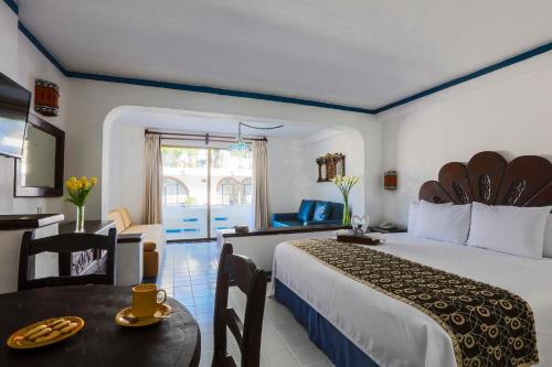Postel nebo postele na pokoji v ubytování Los Arcos Suites