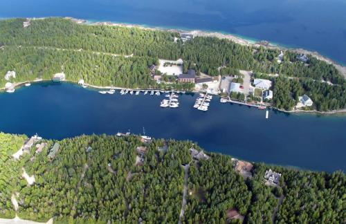 an aerial view of a small island with boats in the water at Big Tub Resort & Marina in Tobermory