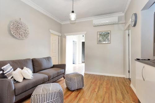 a living room with a couch and a table at North Central Holiday Home in North Mackay