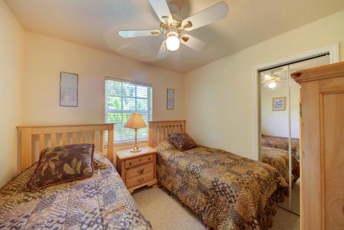 a bedroom with two beds and a ceiling fan at Beautiful property on Siesta Key in Siesta Key