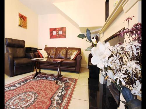 a living room with a couch and a table at Sive Budget Accommodation in Cahersiveen