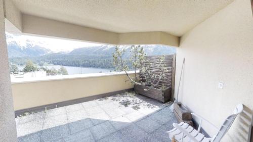 a balcony with a view of a mountain at Caspar Badrutt - St. Moritz in St. Moritz