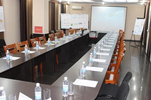 a conference room with a long table with bottles of water at Tagaytay Karakol Hotel in Karakol