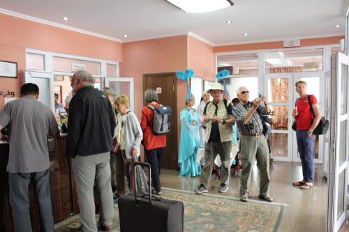 a group of people standing in a room at Tagaytay Karakol Hotel in Karakol