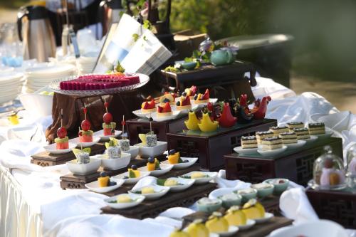 a table with many different types of food on it at Zhejiang Xizi Hotel in Hangzhou
