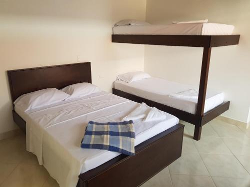 Postel nebo postele na pokoji v ubytování Hotel La Ceiba