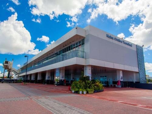 a large building with a sign on the side of it at CABIN&HOTEL ReTIME in Naha