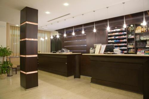 a store with a cashier counter in a room at Magic Hotel in Atena Lucana