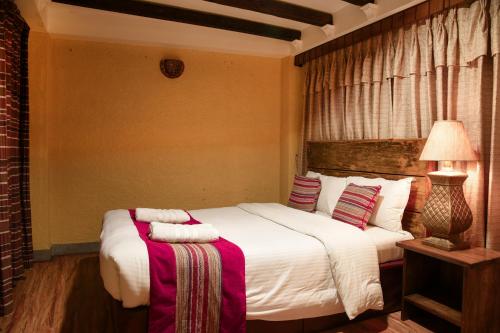 a bedroom with two beds with towels on them at Nepal Pavilion Inn in Kathmandu