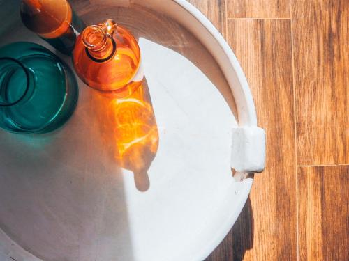 a water fountain with a green and orange bottle at Mayara pool villas - Adults only in Haad Yao