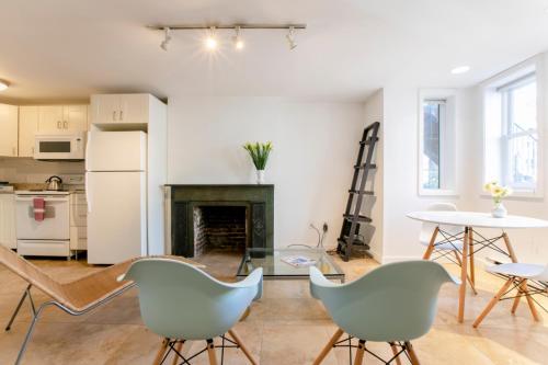 a living room with chairs and a fireplace at Big Bright 1 BR at U/Shaw + 14th on Quaint Swann in Washington