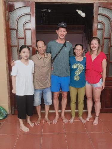 a group of people posing for a picture at Hiep Tung homestay in Tân Hiệp