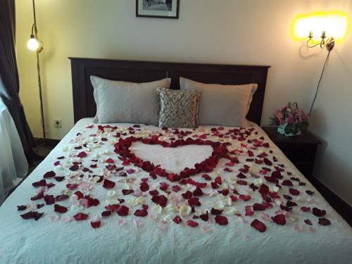 a bed with a heart made out of roses at Ekaterinoslav in Dnipro