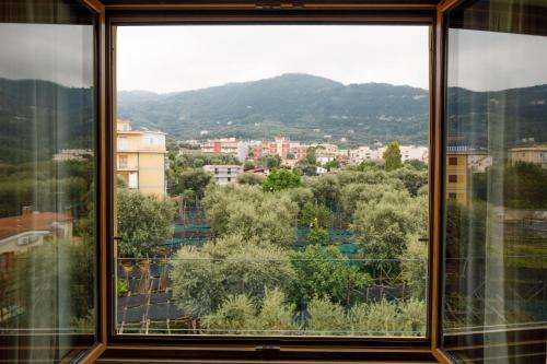 a view of a city from a window at Le Muse Suite in Sorrento