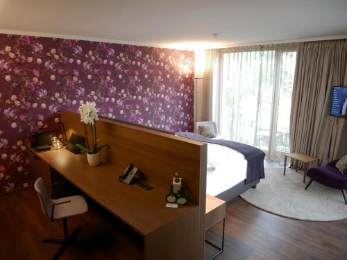 TV a/nebo společenská místnost v ubytování Best Western Premier Hotel Rebstock