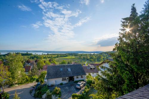 an aerial view of a house with a garage at Das Nest am Wohrenberg in Daisendorf