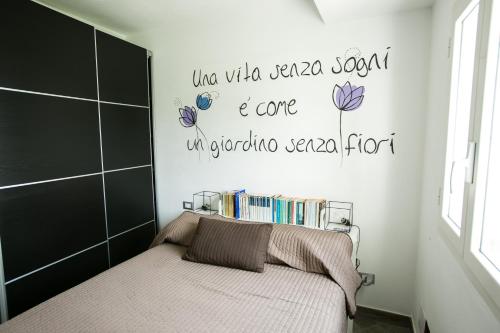Postel nebo postele na pokoji v ubytování Agriturismo Oltrealmare