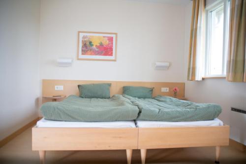 Säng eller sängar i ett rum på Resort Yxenhaga