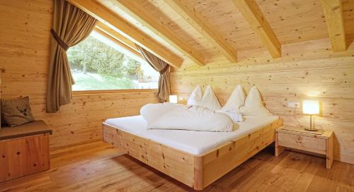Ένα ή περισσότερα κρεβάτια σε δωμάτιο στο Chalet Oberguggenberg