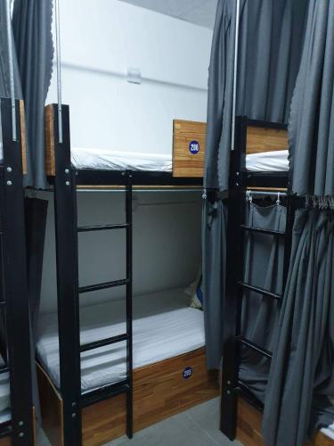 a group of bunk beds in a room at Starfish Alley Hostel in Da Nang