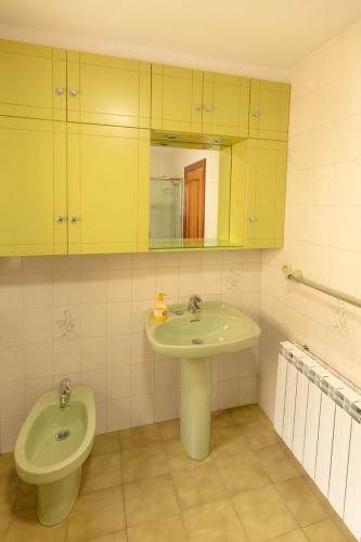 a bathroom with a sink and a toilet at La capitana Llanes in Llanes