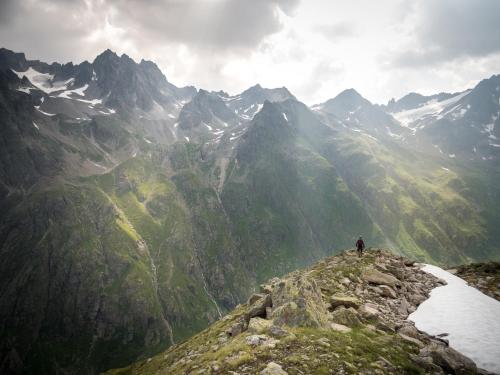 a person standing on top of a mountain at Rosa Canina Superior in Sankt Anton am Arlberg