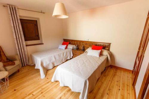 Ένα ή περισσότερα κρεβάτια σε δωμάτιο στο La capitana Llanes