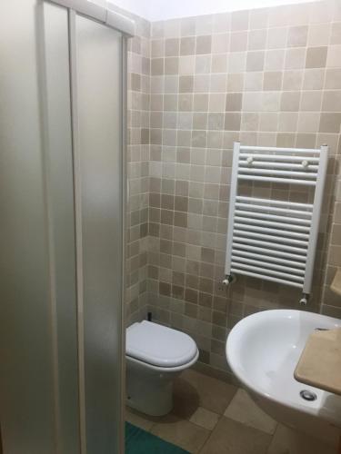 a bathroom with a toilet and a sink at Palazzo Grigio in Bari