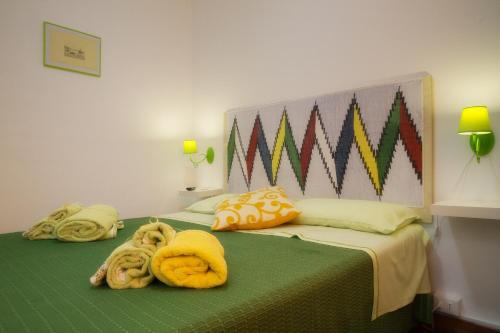 a bedroom with two beds with towels on them at Bella Vista b&b in Erice