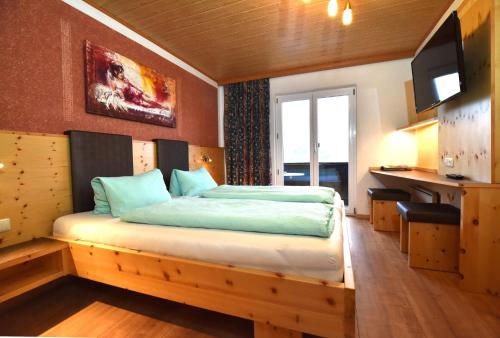 Postel nebo postele na pokoji v ubytování Gasthaus Schöberingerhof