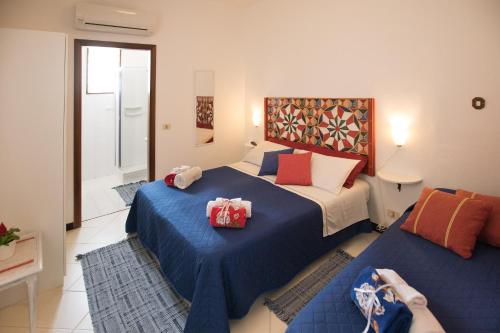 a bedroom with two beds with presents on them at Bella Vista b&b in Erice