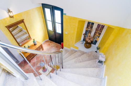 an overhead view of a staircase in a house with a door at Stone House DiMaTo in Gruda