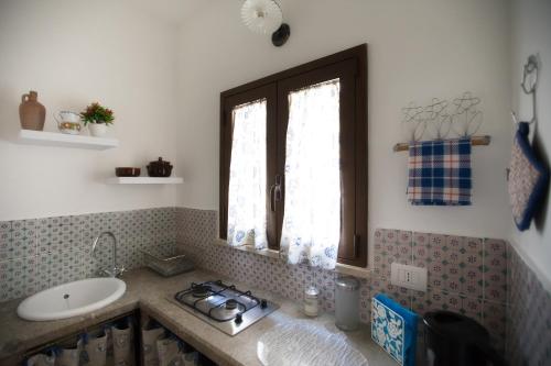 a bathroom with a sink and a sink at Bella Vista b&b in Erice
