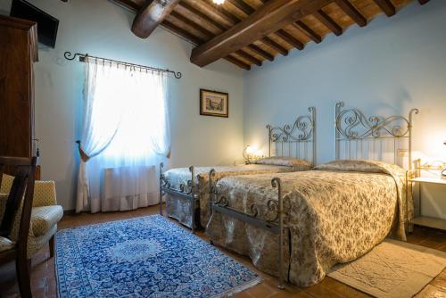 เตียงในห้องที่ Hotel & SPA L'Antico Forziere