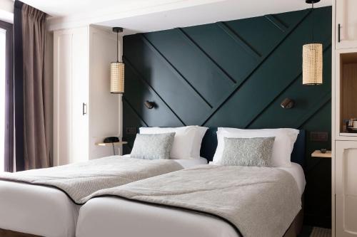 En eller flere senge i et værelse på Hotel Bastille Speria