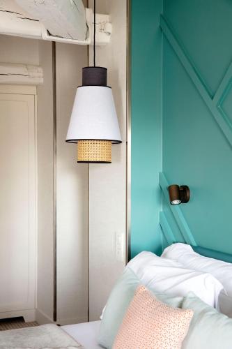 En eller flere senge i et værelse på Hotel Bastille Speria