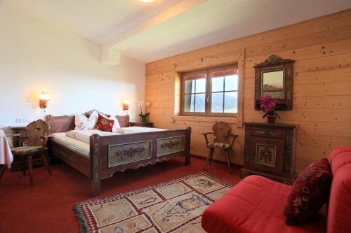 Ένα ή περισσότερα κρεβάτια σε δωμάτιο στο Gasthaus Obergaisberg