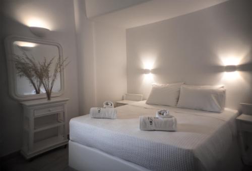 Ένα ή περισσότερα κρεβάτια σε δωμάτιο στο Helios Beach Hotel