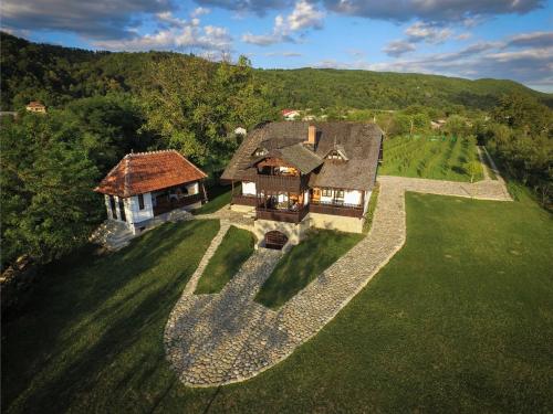 an aerial view of a house in the middle of a field at Satul Banului Guesthouse in Măgureni