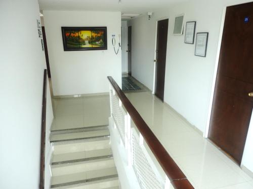 a hallway with stairs in a building at Hotel Casa Sarita in Bogotá