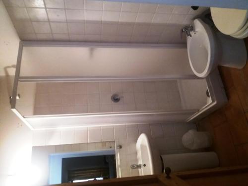 a bathroom with a mirror and a sink and a toilet at Marco & Andrea Agriturismo Collepina in Amelia