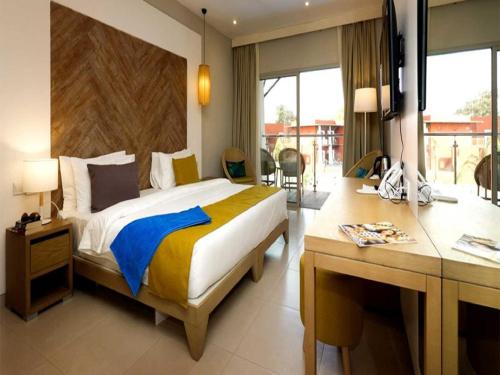 African Princess Beach Hotel tesisinde bir odada yatak veya yataklar