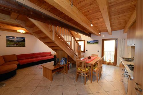 a living room with a couch and a table at Vieilles Maisons D'Introd in Introd