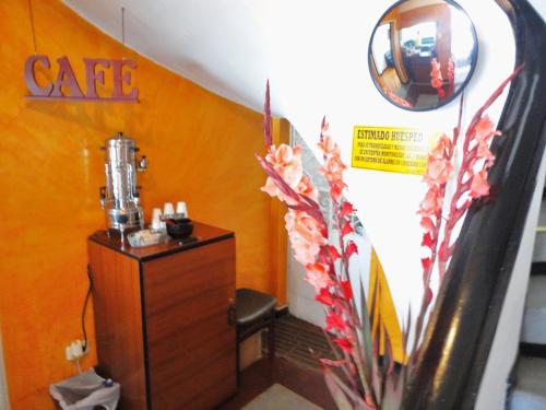 a room with a table and a chair in a room at Hotel Casa Paulina in Bogotá