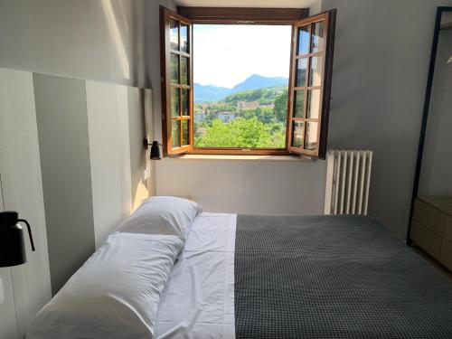 En eller flere senge i et værelse på Locanda della Posta